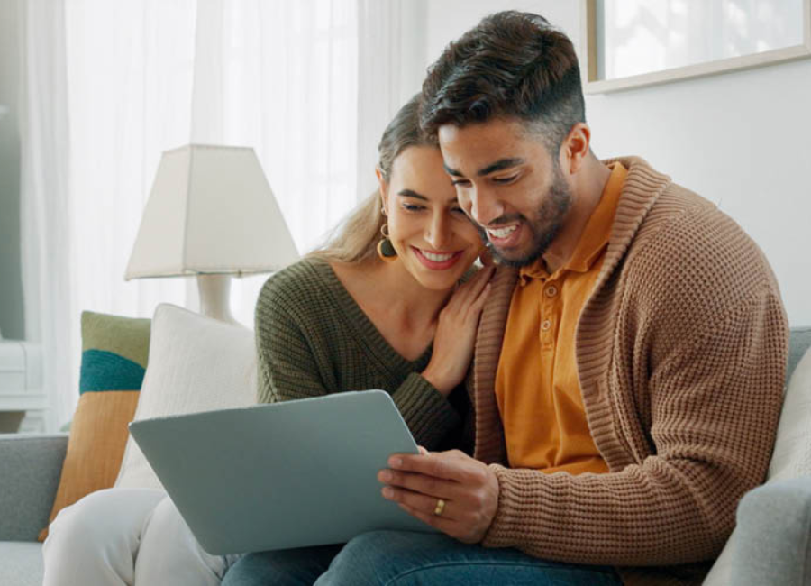 Couple looking into their home equity options on laptop